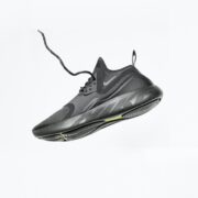 unpaired gray Nike running shoe